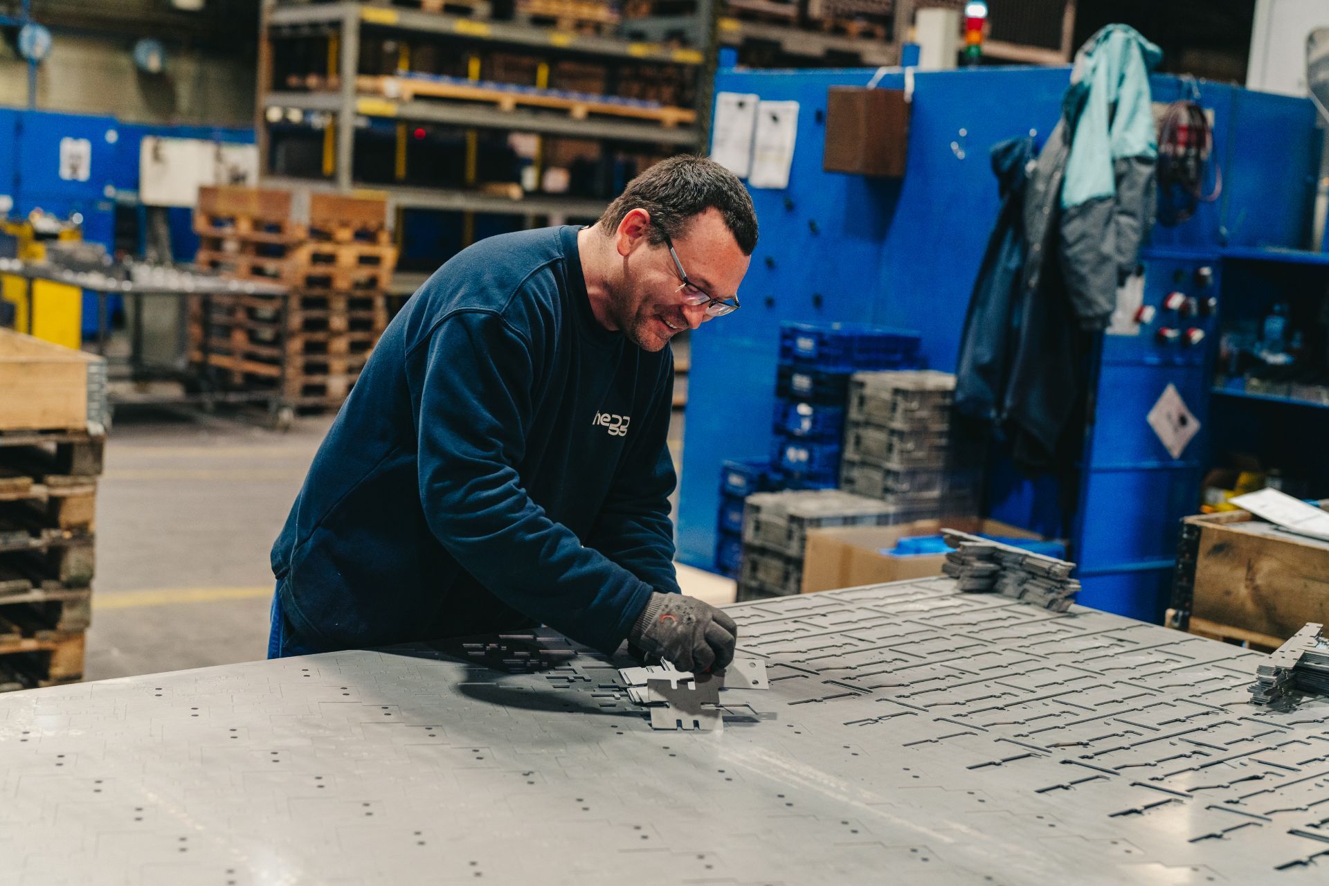 Hegge employee engaged in precision work and smiling